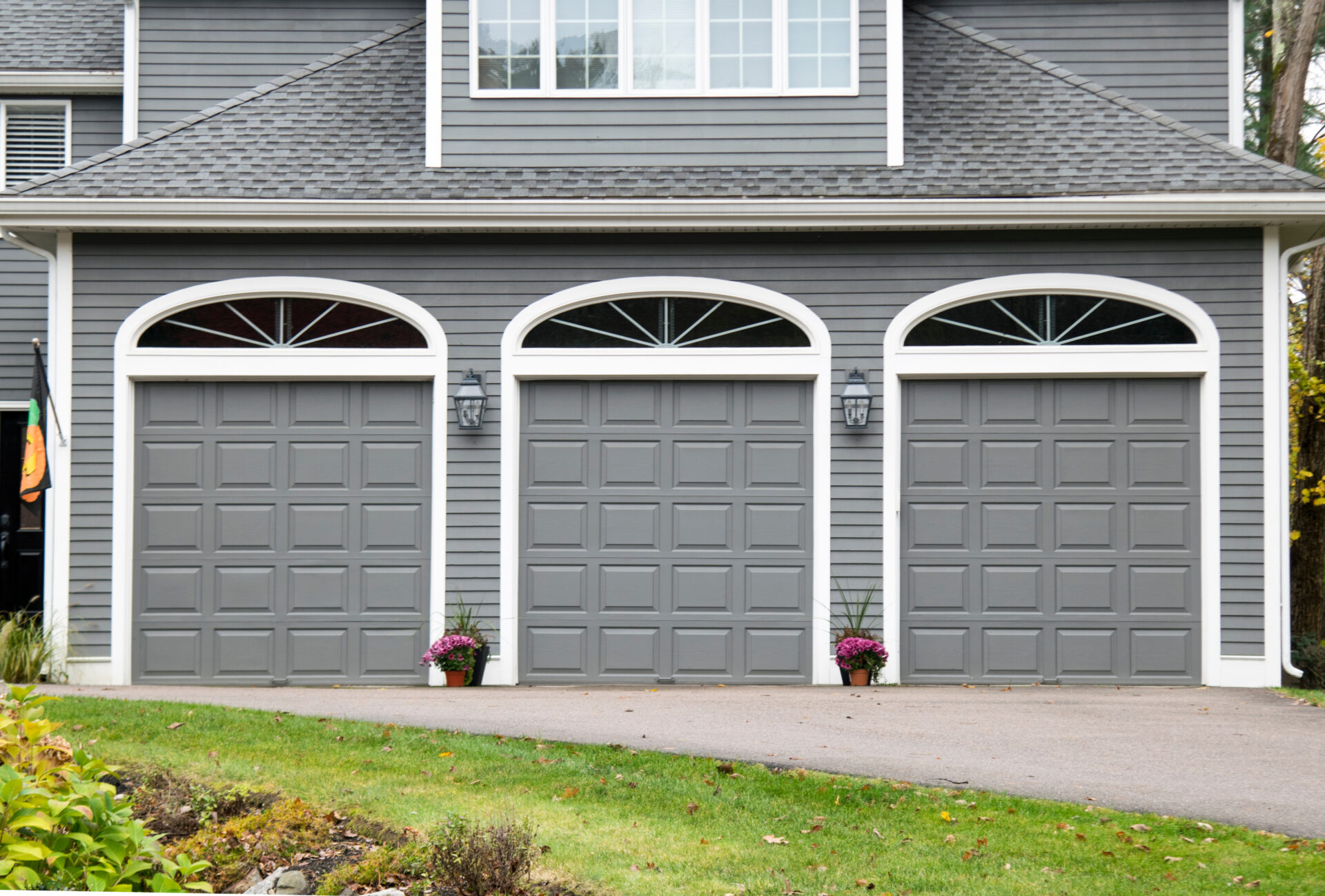 GARAGE DOOR at a typical single house painted in grey color